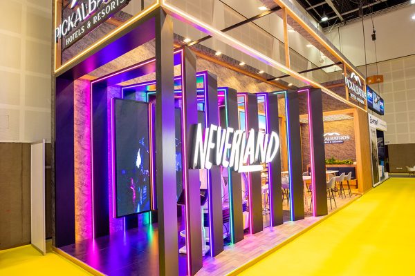A curved pop up stand built for Neverland by Strokes Exhibits